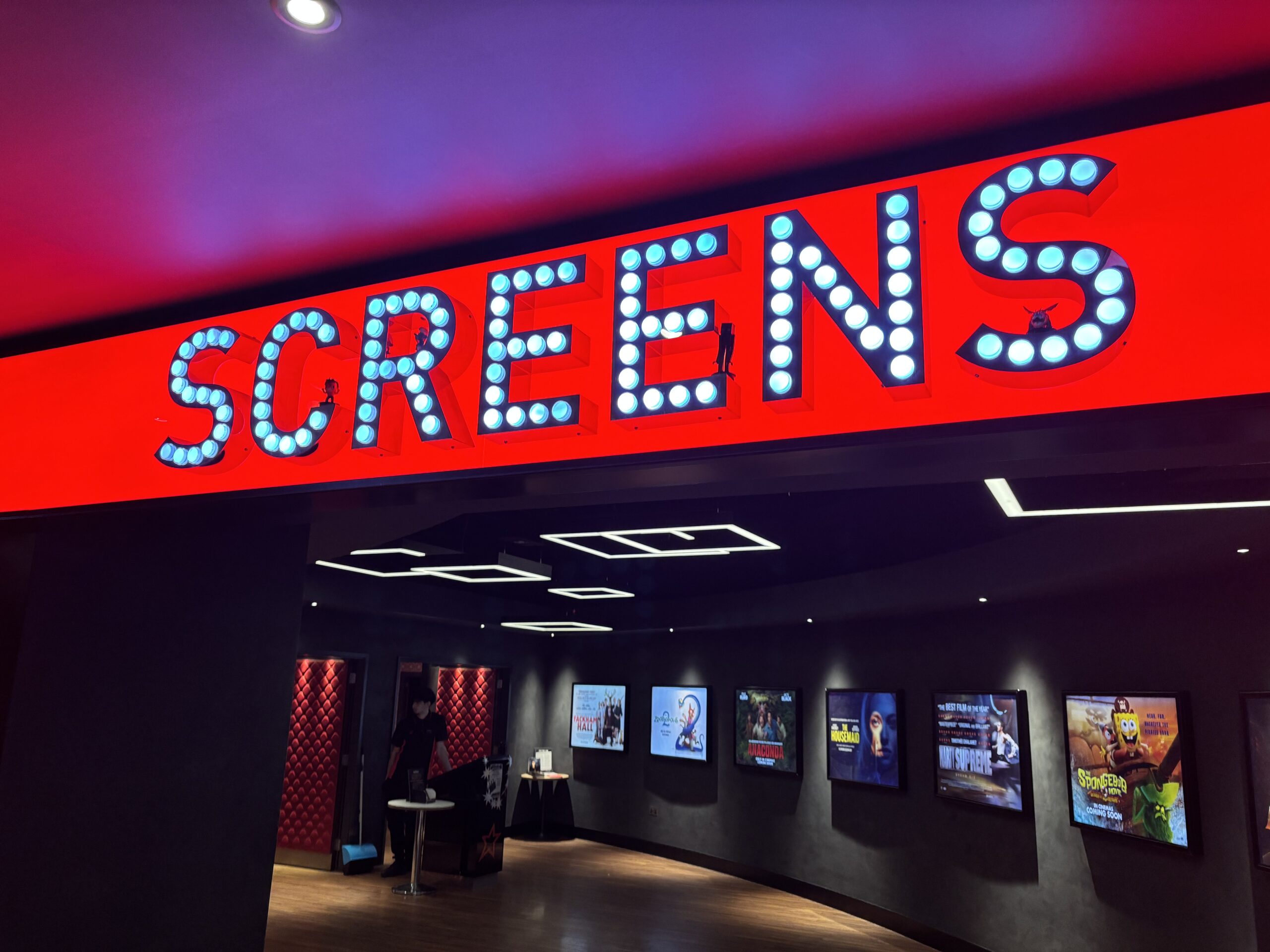 A trip to the cinema in Hemel Hempstead. Someone had placed a bunch of small action figures on the illuminated sign.