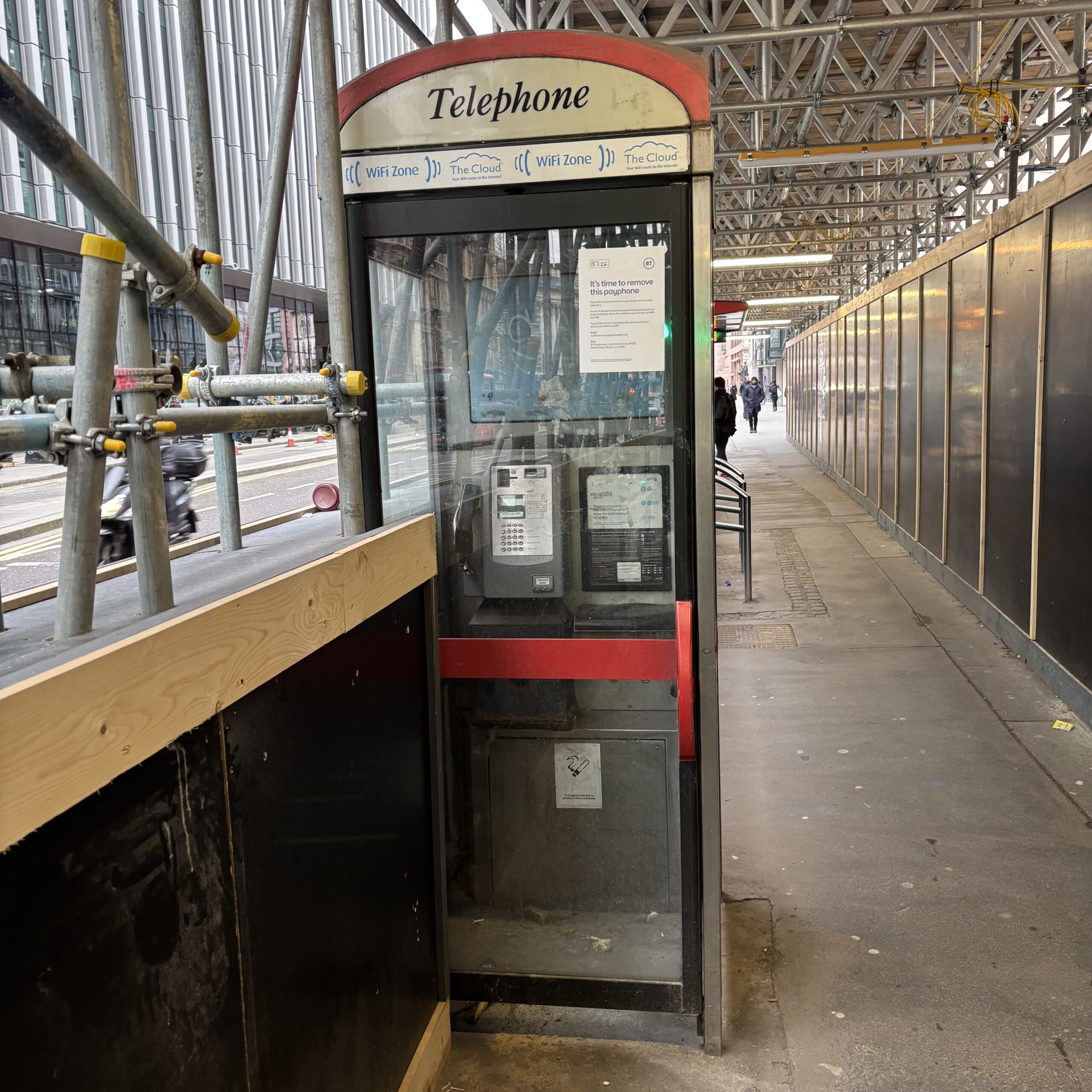 Stopped to photograph this phone box on my walk to work, as the construction work means that you can’t open the door. Then I noticed that it’s due to be removed.